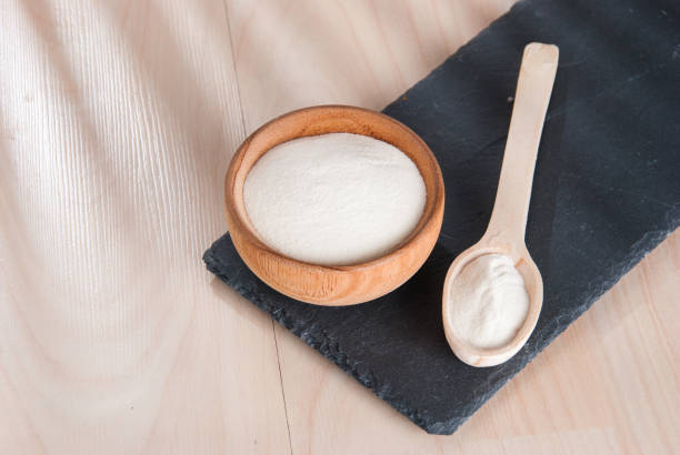 istock Hydrolyzed collagen protein on wooden table 1368304361