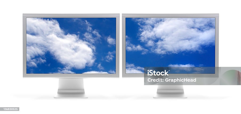 Wide Open (extra hi-res) Front shot of dual flat panel monitors (LCD) with blue sky and clouds. Isolated on white. EXRTA HI-RES! Computer Monitor Stock Photo