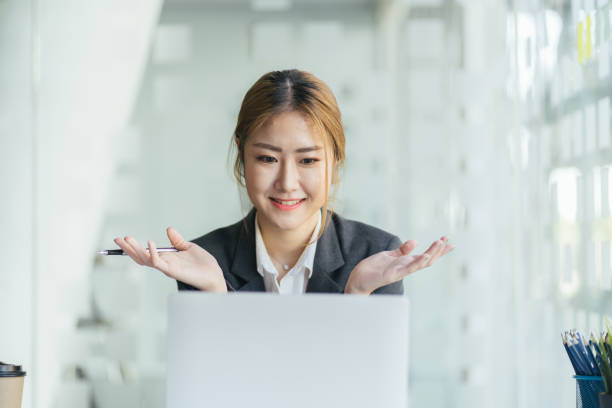 istock Woman having a teleconference at her desk 1368306017