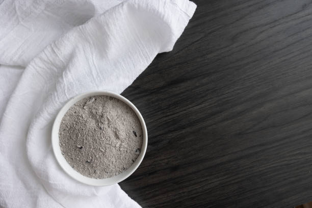 istock White bowl of ashes and white linen on wood 1368306065
