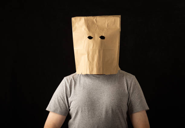 Man wearing a brown paper bag over his head