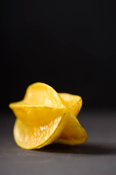 Star fruit on black background Star fruit on black background. Organic fruit from Thai farmer in local market starfruit stock pictures, royalty-free photos & images