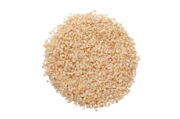 istock Seeds of brown crushed rice. View from above. White background. Isolated. 1368312401