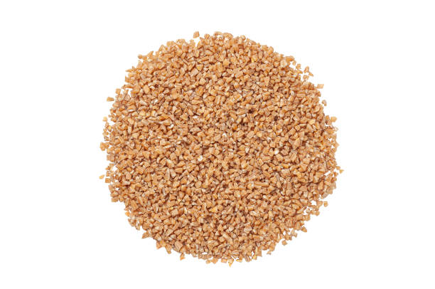istock Crushed spelled groats. View from above. White background. Isolated. 1368312405
