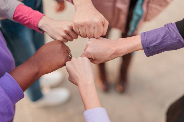 feminist movement hands togetherness group of multicultural woman stock photo