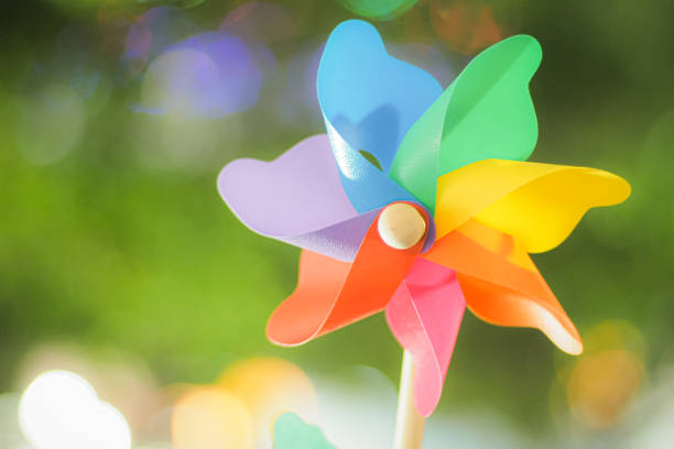 istock rainbow pinwheel toy with golden bokeh 1368316593