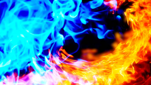 istock Background image of blue and red flames facing each other 1368318442