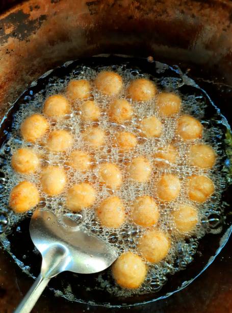 Frying Shrimp Meatballs in cooking pan - food preparation. stock photo