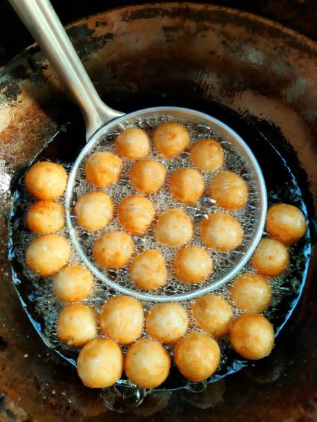 Frying Shrimp Meatballs in colander - food preparation.