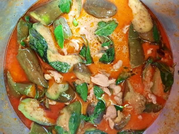 Cooking Red Curry with Egg plant - food preparation.