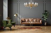 Elegant Living Room Interior With Green Velvet Armchairs, Brown Leather Sofa, Floor Lamp, Coffee Table And Empty Wall