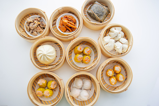High angle view of variety of dim sum dishes