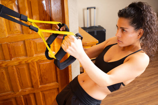 istock girl practicing back exercise in a hotel room 1368325694