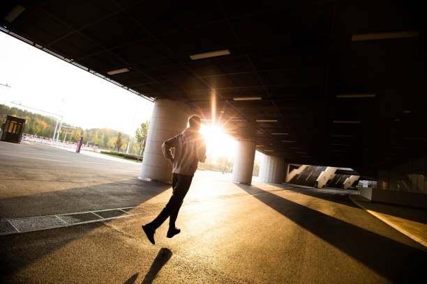 istock Young man running in the city morning 1368326626