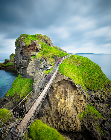 Carrick-a-Rede rope bridge in Northern Ireland. The suspension bridge built by salmon fishermen links the mainland to the tiny island of Carrickarede.