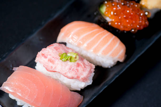 istock Fresh sushi served on a long plate. 1368328546