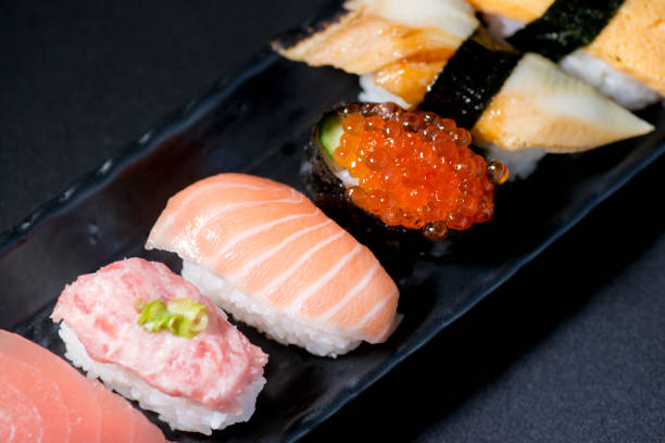 istock Fresh sushi served on a long plate. 1368328550