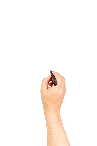 istock Writing male hand. Hand hold black pen write on the wall isolated on white with clipping path 1368328667