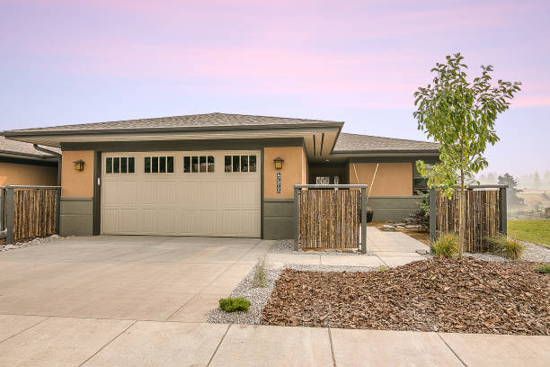 istock Front elevation of yellow rambler home in Montana 1368331799