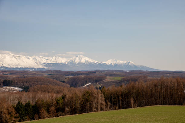 istock Hills and snowy mountains in spring 1368332075
