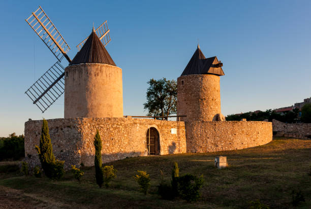 istock windmills in Regusse, Provence, France 1368338429