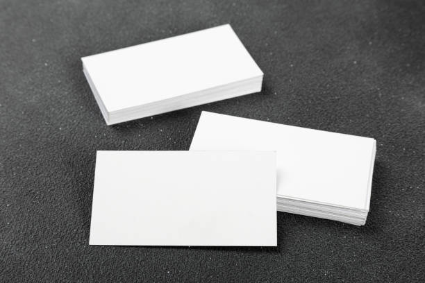 istock Business cards blank. Mockup on black background. Copy space for text. 1368338975