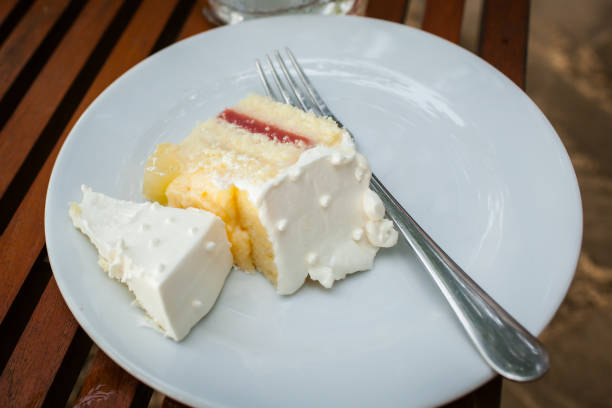 The wedding cake is cut into pieces.