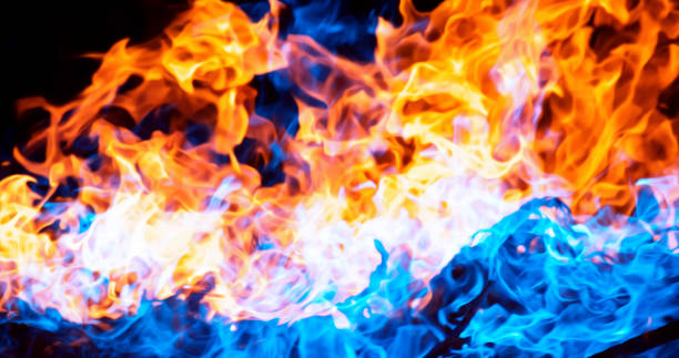 istock Background image of blue and red flames facing each other 1368342020