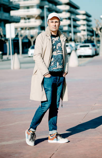 istock modern middle-aged man standing in a urban space 1368344054
