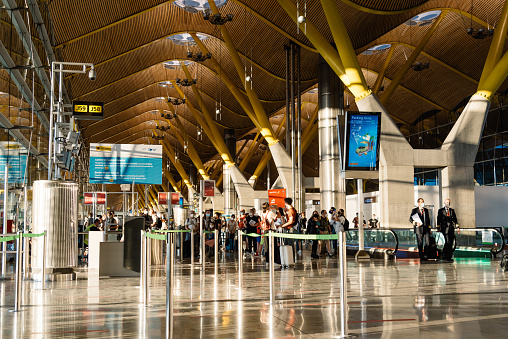 Madrid, Spain - August 2, 2021: Barajas Airport. T4 Terminal. Madrid-Barajas Adolfo Suarez international airport is the main airport of the capital. Interior view of people waiting for boarding