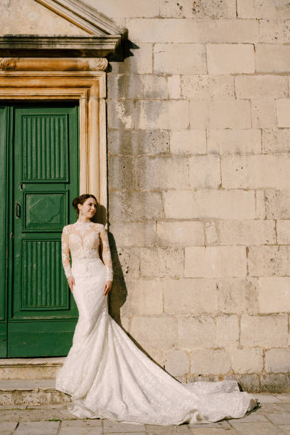 istock Woman Standing Against Wall With Closed Door 1368348239