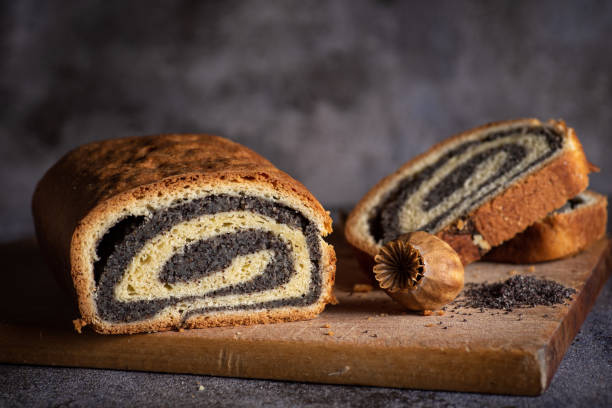 Poppy seed roll on wooden background