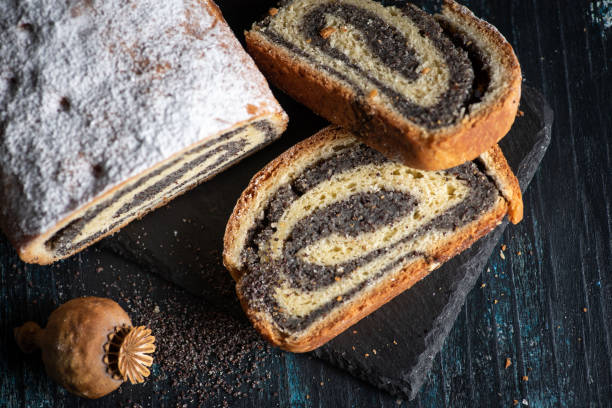 istock Sliced poppy seed strudel sweet roll on a rustic board 1368349029