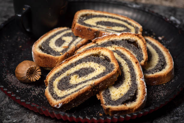 istock Sliced poppy seed strudel sweet roll on a rustic board 1368349111