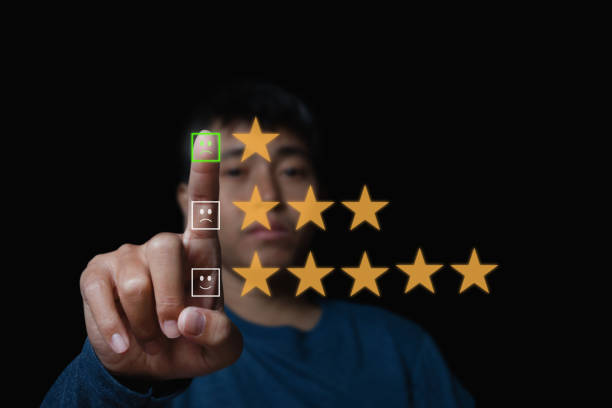 istock man touching the virtual screen on the sad face icon on the digital touch screen. Customer service evaluation concept. 1368350138