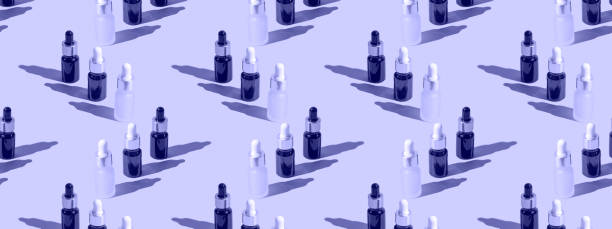 istock Cosmetic bottle mockup with cosmetics on very peri background with hard shadows, copy space closeup.  pattern 1368350353