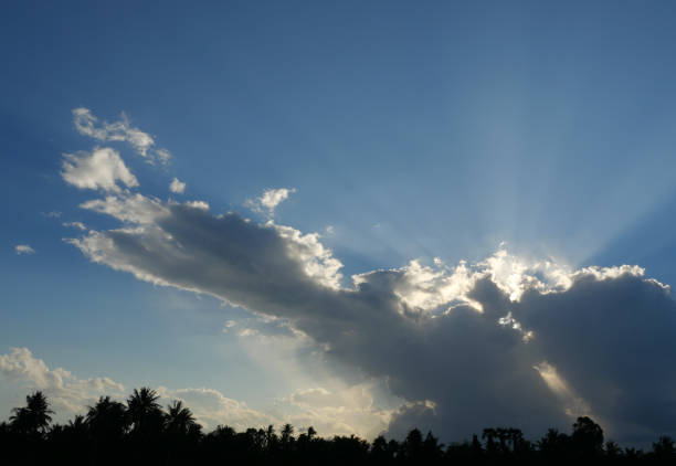 istock Cumulus cloud with sunbeam on beautiful blue sky 1368351032