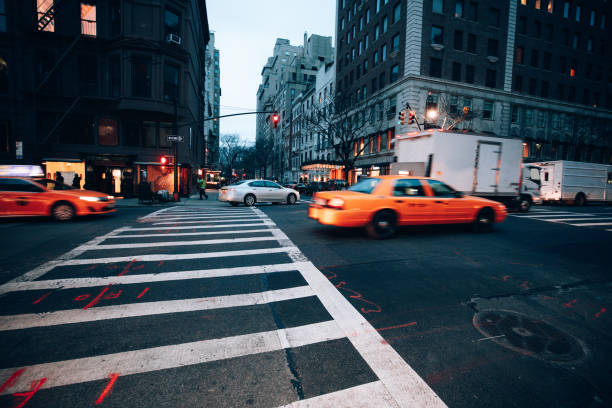 Traffic in New York downtown at dusk.