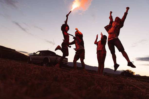 istock Gourp of friends playing with fireworks 1368351137