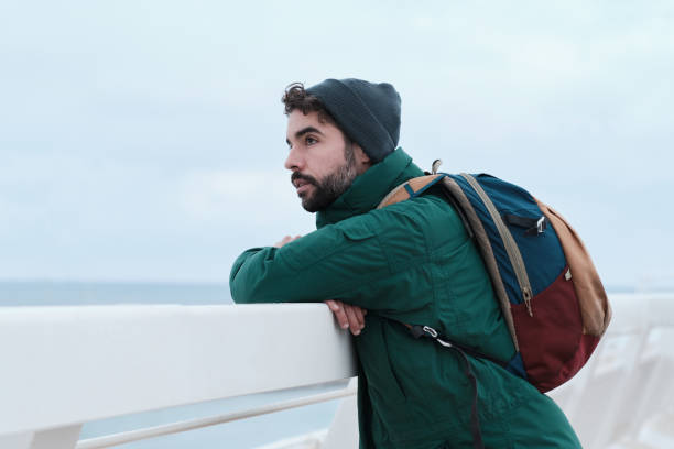 istock A young man looks at the view. 1368351143