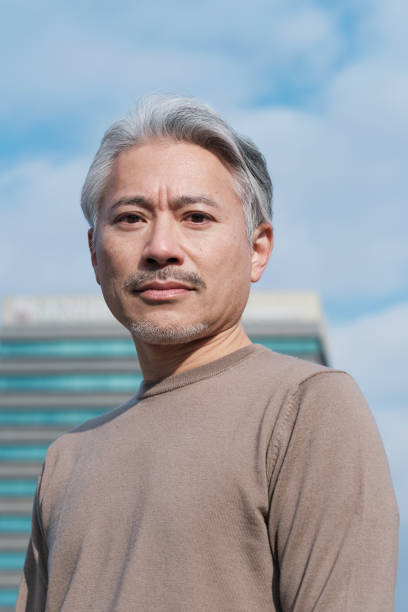 istock A Japanese man's headshot outdoors. 1368351410