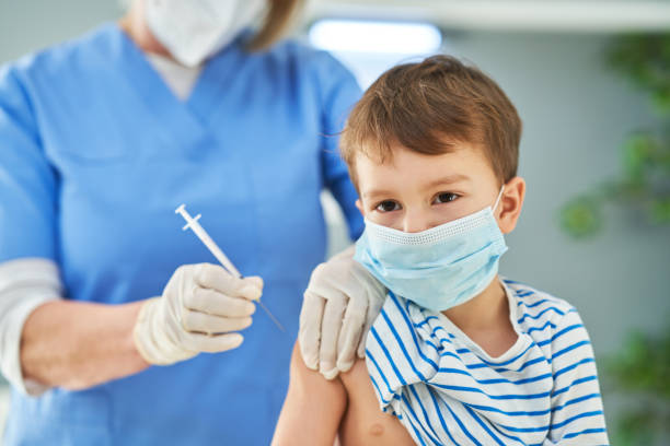 istock Young kids during vaccination in hospital 1368351666