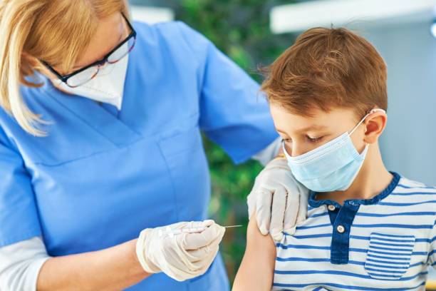 istock Young kids during vaccination in hospital 1368352384