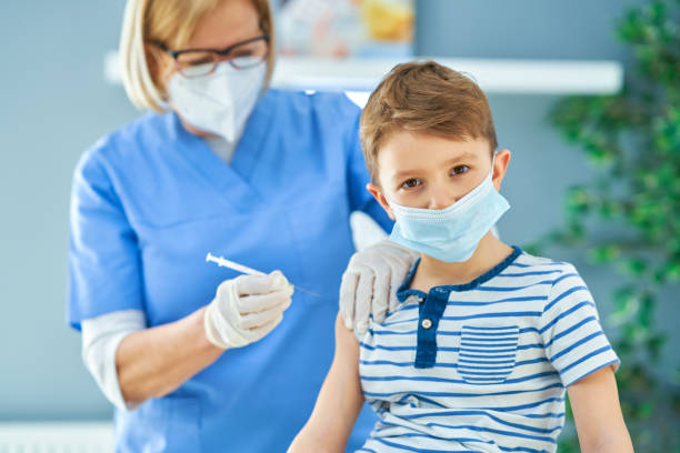 istock Young kids during vaccination in hospital 1368352394
