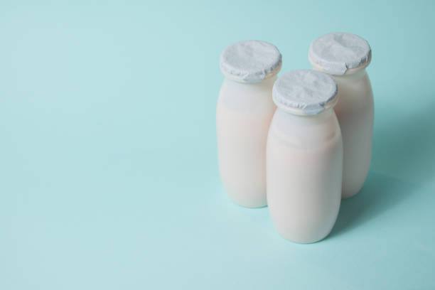 istock Bottles with probiotics and prebiotics dairy drink on light blue background. 1368353457