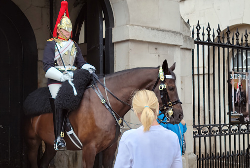 London, UK - February 7 2022: Household Cavalry mounted guard on duty at Horse Guards building in Westminster.