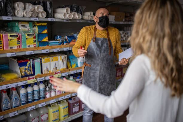 istock Unrecognizable female customer arguing with a salesman about product at the store 1368356336