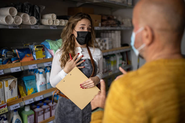 istock While wearing protective face mask, unrecognizable boss scolding his female employee at the store 1368357578