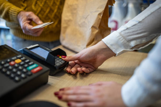 istock Saleswoman preparing the credit card reader 1368357732