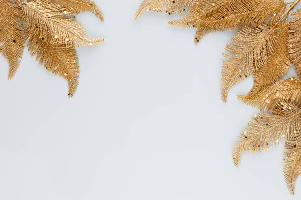istock Palm gold leaf on blue background. Palm leaf, Flat lay and top view. 1368359200